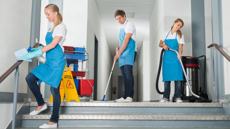 Cleaning staff working in a hallway
