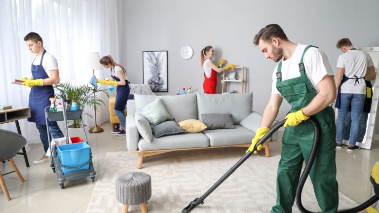Cleaning crew working in a modern living room